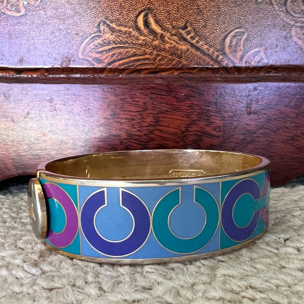 Gold Toned Coach Bangle with “C” logo motif